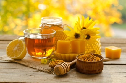 Still life from cup of tea , lemon, honey, wax , honeycombs and